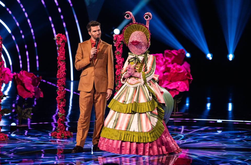 Joel Dommett and the Snail contestant on The Masked Singer.