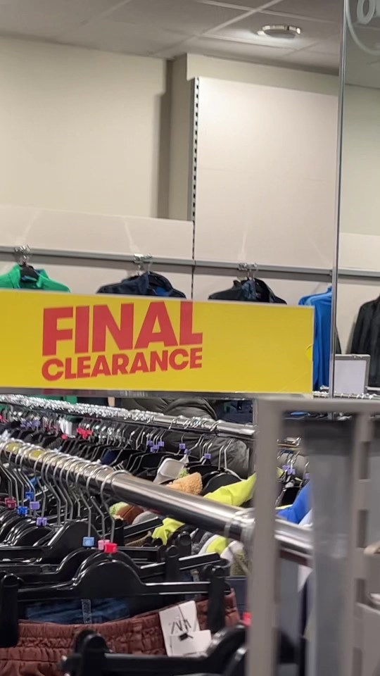 TK Maxx final clearance sale sign above clothing racks.