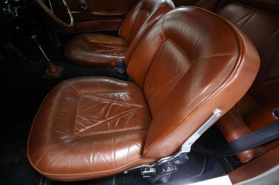 Brown leather interior of a classic Aston Martin DB6.