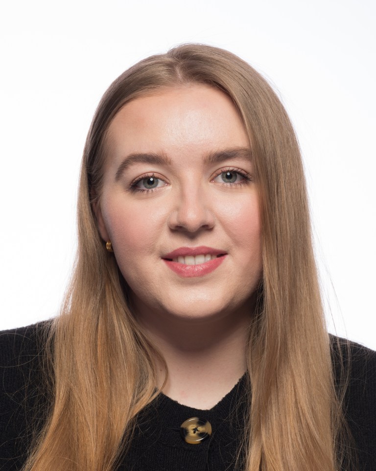 Headshot of a woman with long blonde hair.