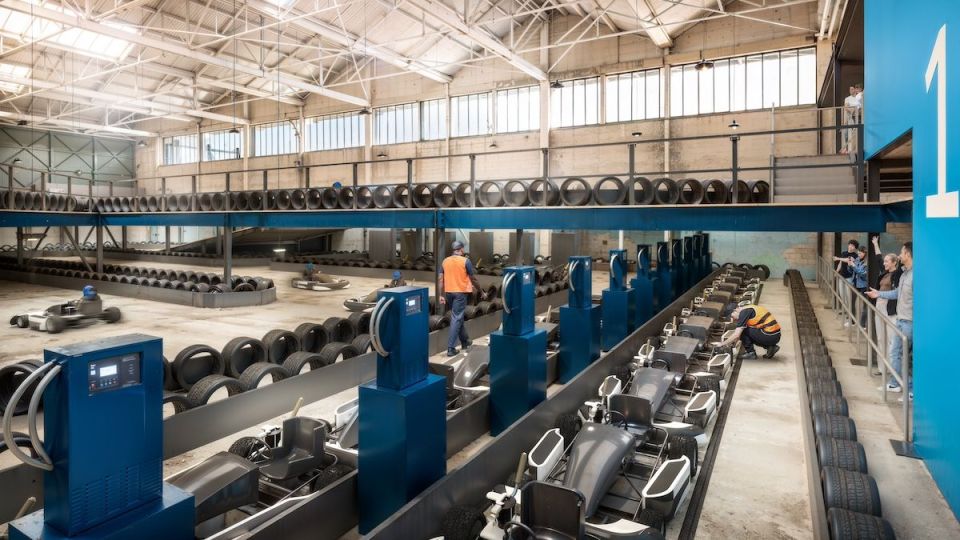 Interior view of a new electric go-karting center.