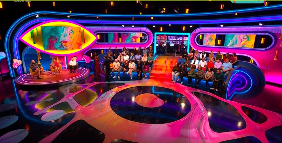 Big Brother reveal show with audience and hosts.