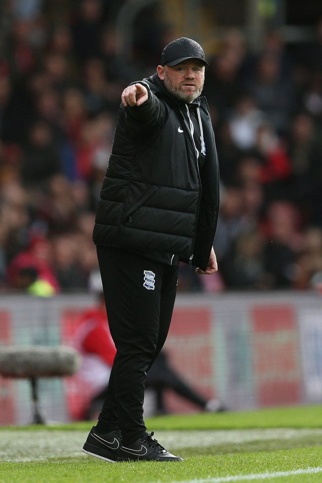 Wayne Rooney, Birmingham City manager, giving instructions on the field.