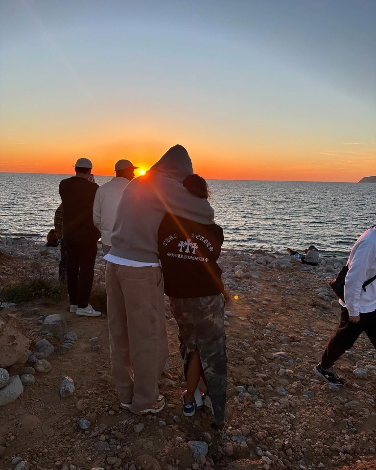 Centre back footballer Ruben Dias shared this loved up snap where he is pictured watching a sunset with Maya