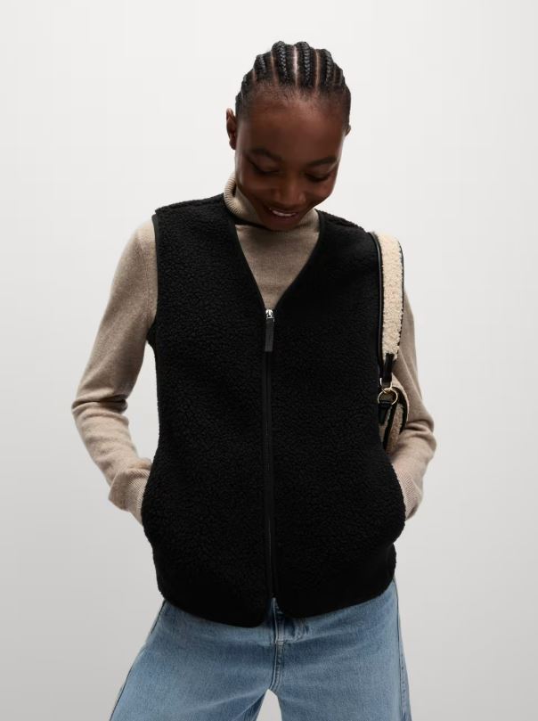 Woman wearing a black borg gilet.