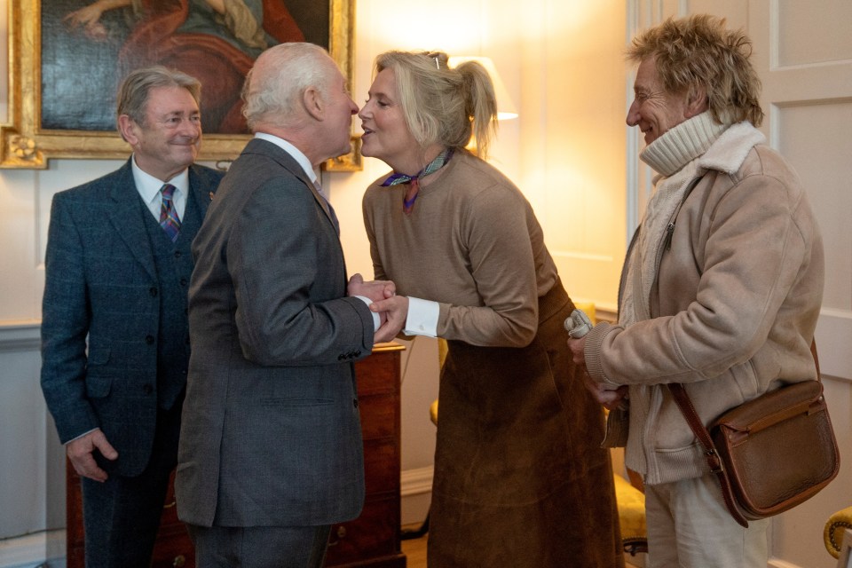 King Charles greeting Penny Lancaster and Rod Stewart at an event.