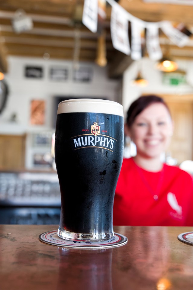 Pint of Murphy's stout beer on bar.