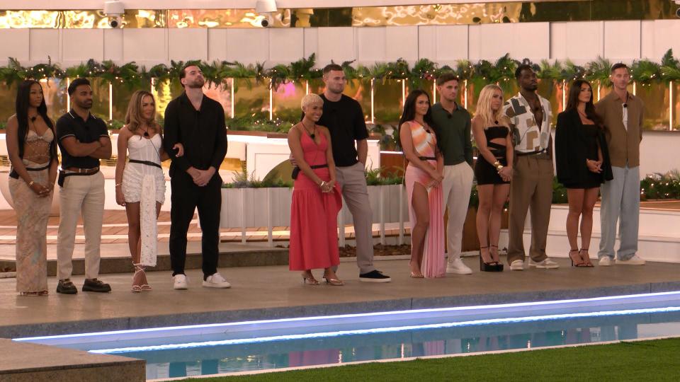 Love Island All Stars contestants posing by a pool.