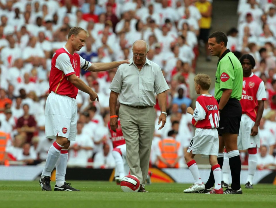 Dennis Bergkamp, his father, and a young boy at a testimonial game.