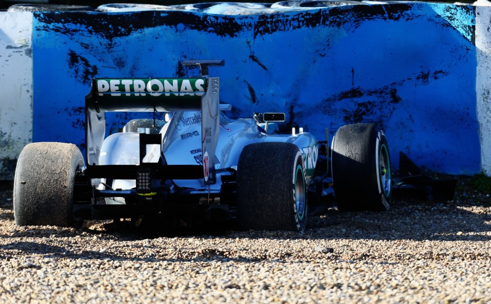 Lewis Hamilton's Formula One car in the gravel after a crash.