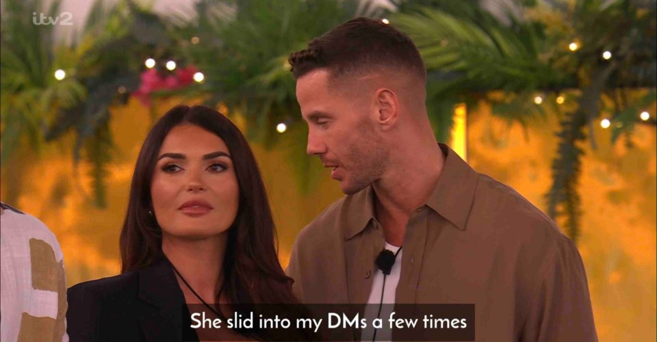 Screenshot from Love Island showing a man and woman talking.