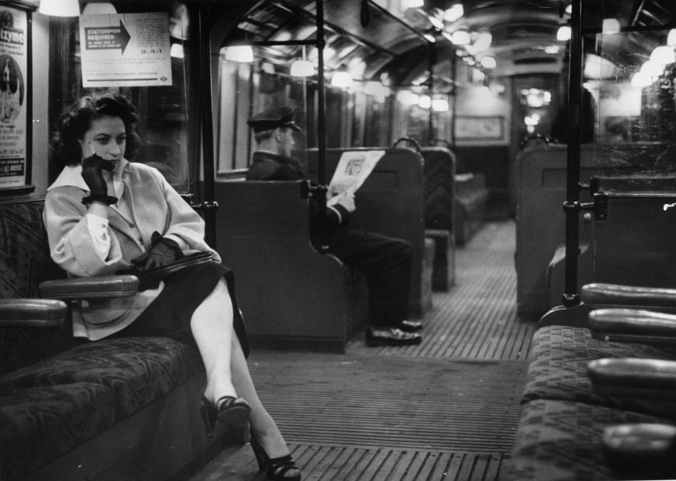 An 18-year-old cabaret dancer smokes on the London Underground.