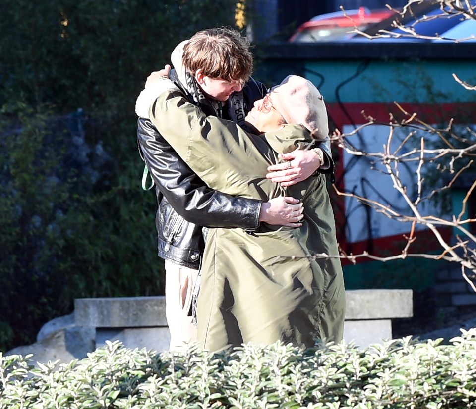 Photo of Alison Hammond and David Putman embracing.