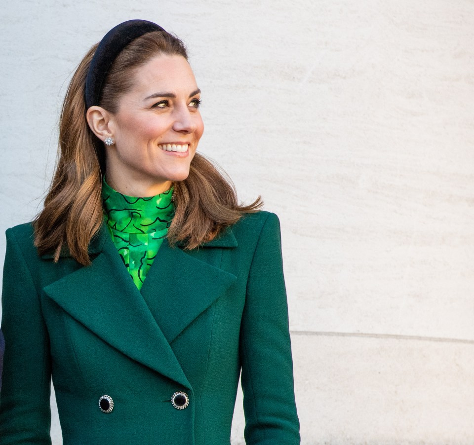 Catherine, Princess of Wales, wearing a green coat and patterned top.