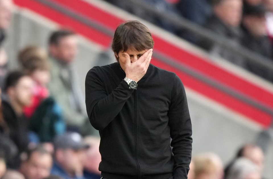 Antonio Conte, Tottenham manager, holding his head in his hands.