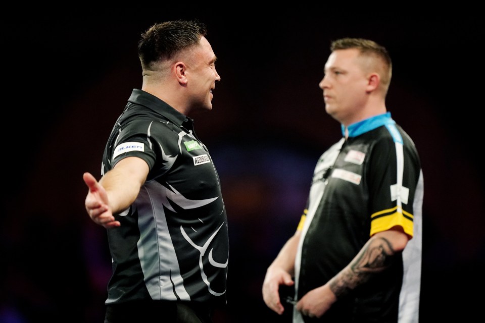 Gerwyn Price celebrates during a quarter-final darts match against Chris Dobey.