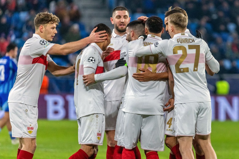 Soccer players celebrating a goal.