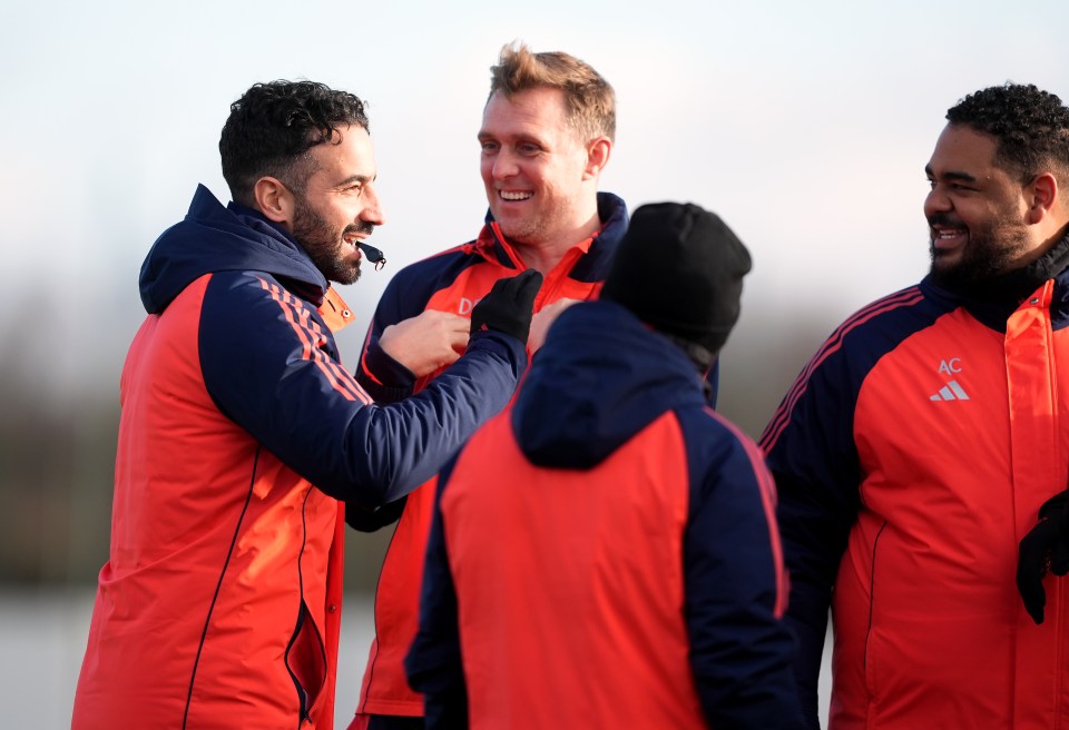 Manchester United managers and coaches at a training session.