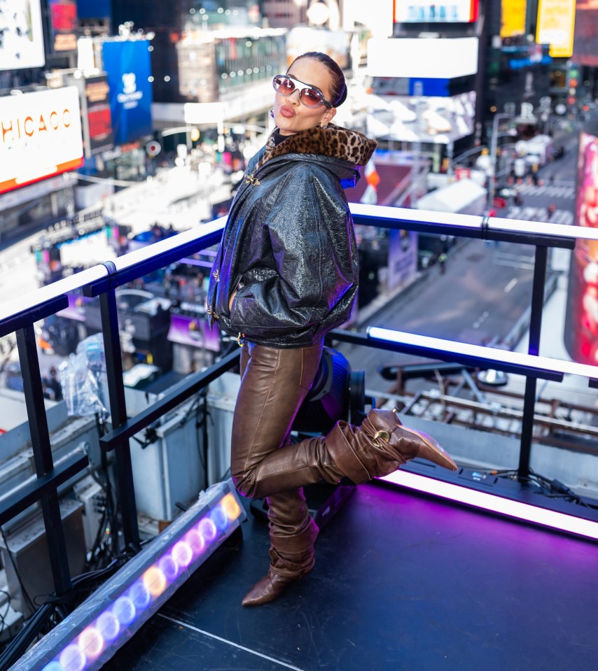 Rita's first look was in brown leather trousers and a black jacket with a furry, leopard print hood