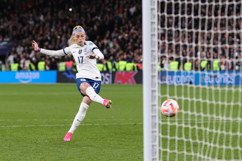 Chloe Kelly of England scoring a winning penalty kick.