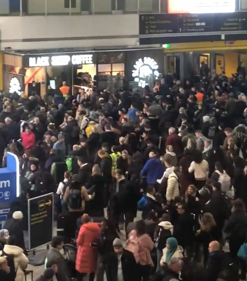 Passengers at Gatwick Airport railway station following the fire