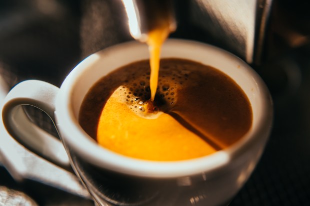 Espresso pouring into a cup.