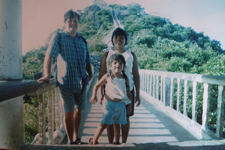 Photo of a family on a bridge.