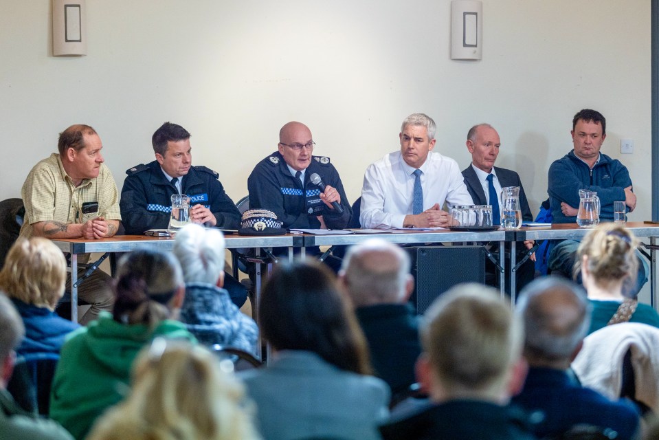 Public meeting addressing police inaction following criminal activity.