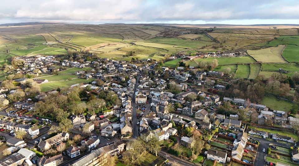 Aerial view of Grassington, Yorkshire Dales, showing the village and surrounding farmland.