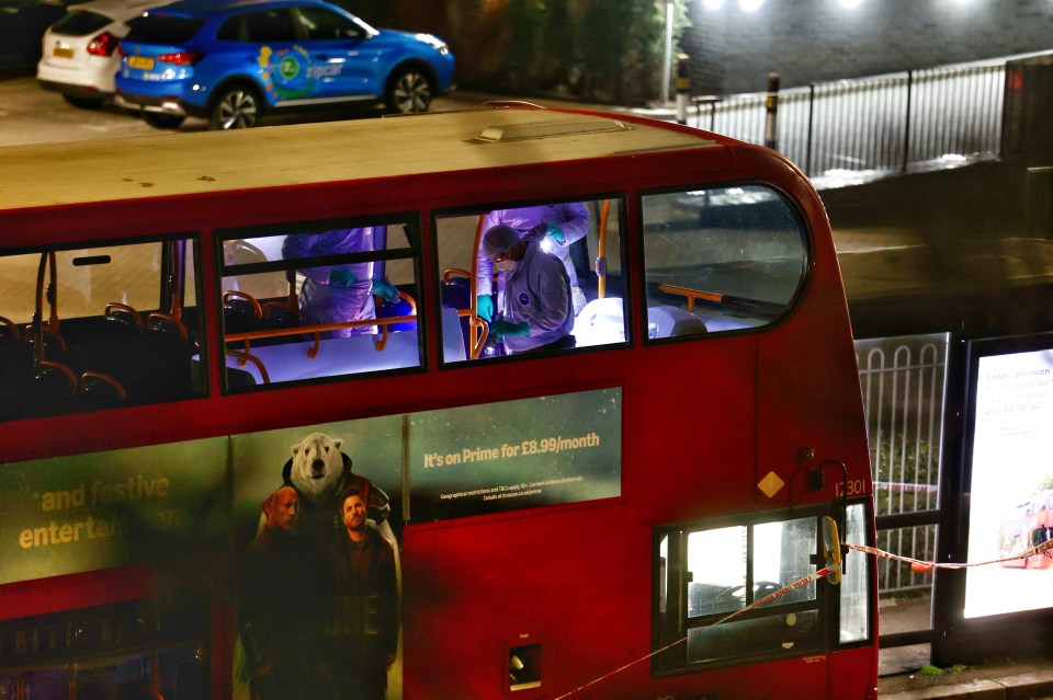 Forensic officers on a crime scene bus.