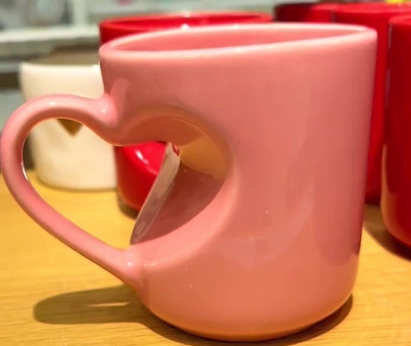 Pink heart-shaped mug.