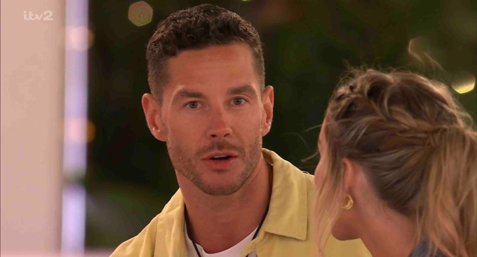 Screenshot from Love Island showing Scott Thomas and Tina Stinnes.