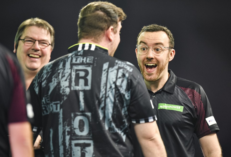 Referee Huw Ware speaks with Callan Rydz at the PDC World Darts Championship.