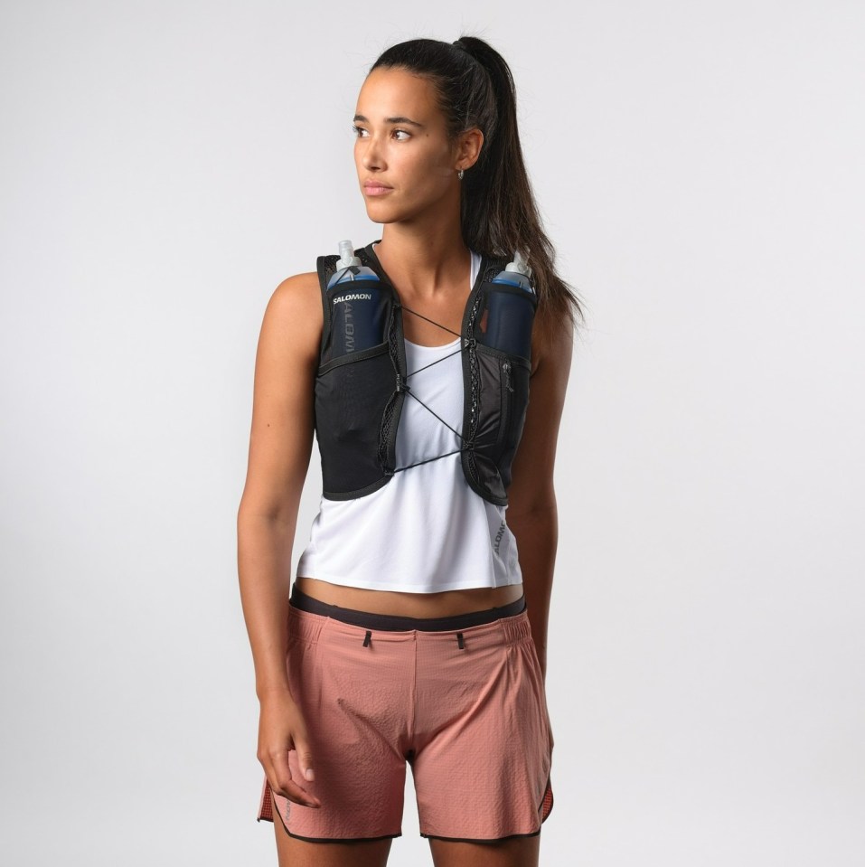 Woman wearing a Salomon running vest.