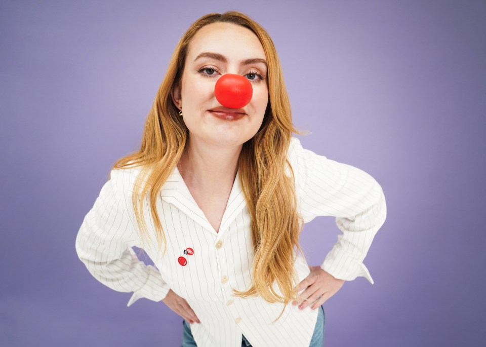 Woman wearing a red nose for Comic Relief.