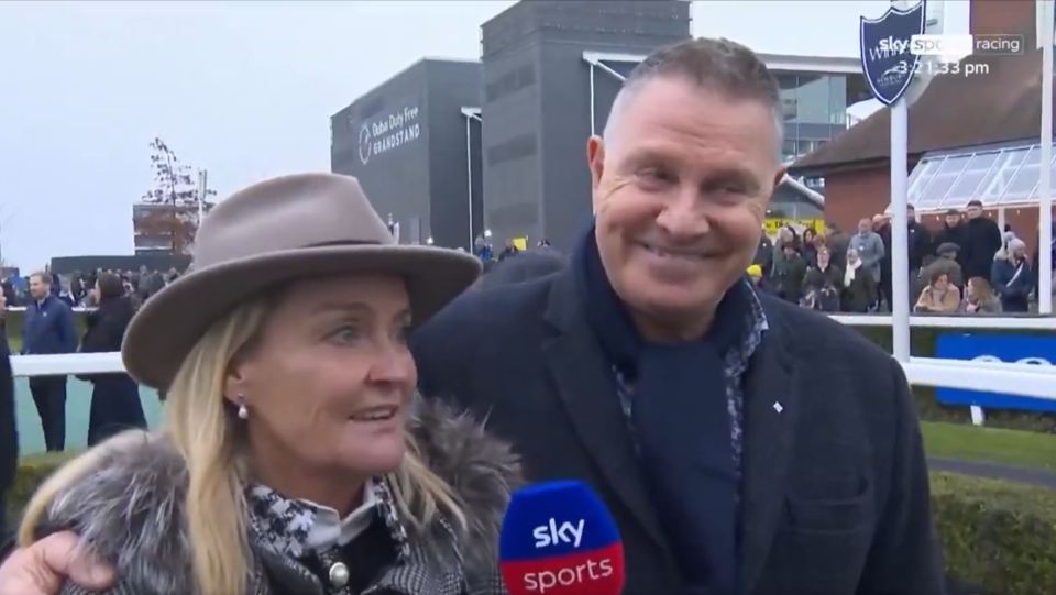 A man and woman being interviewed by Sky Sports at a racetrack.