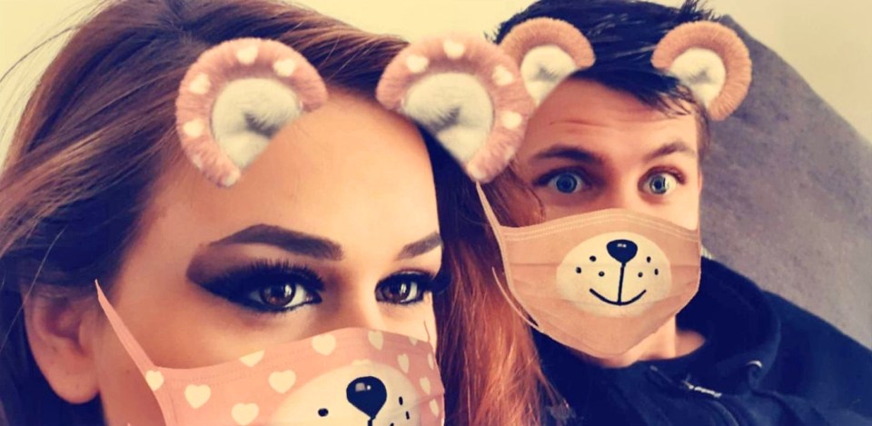 Close-up photo of a couple wearing masks with cartoon animal faces and filters over their eyes.