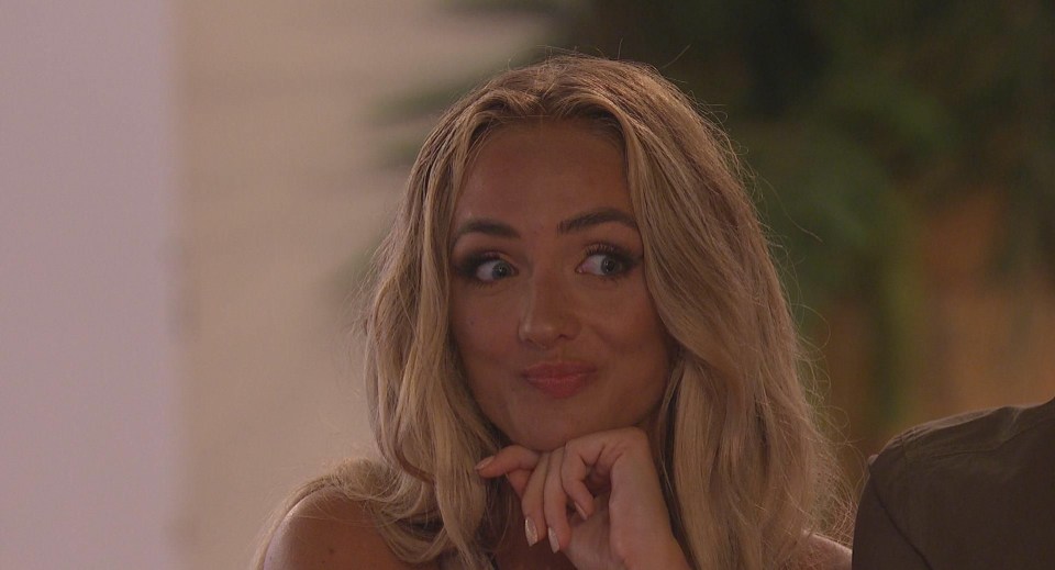 Abi Moores from Love Island reacting.