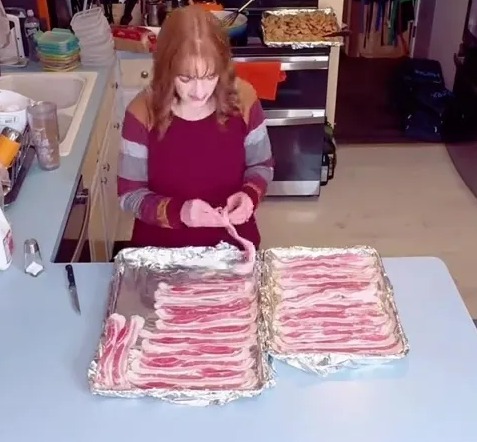 Mom of 11 preparing bacon in the morning.