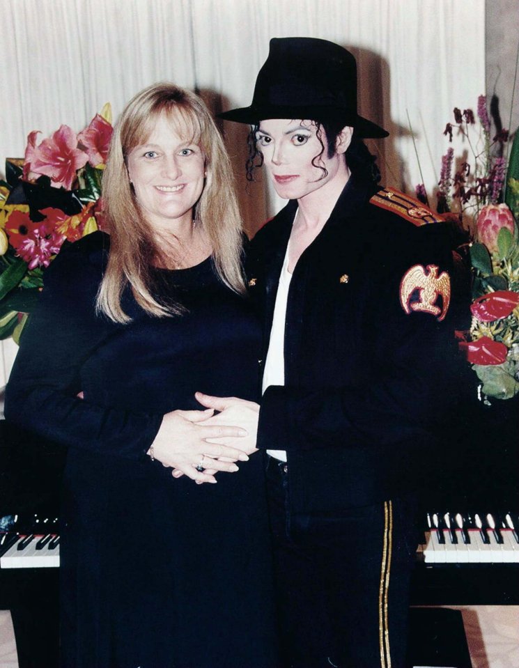 Michael Jackson and Deborah Rowe-Jackson, his wife, at their wedding.  She is pregnant.