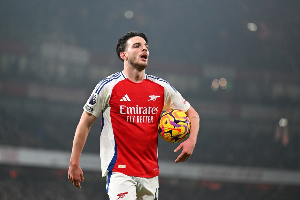 Declan Rice of Arsenal holding a soccer ball.