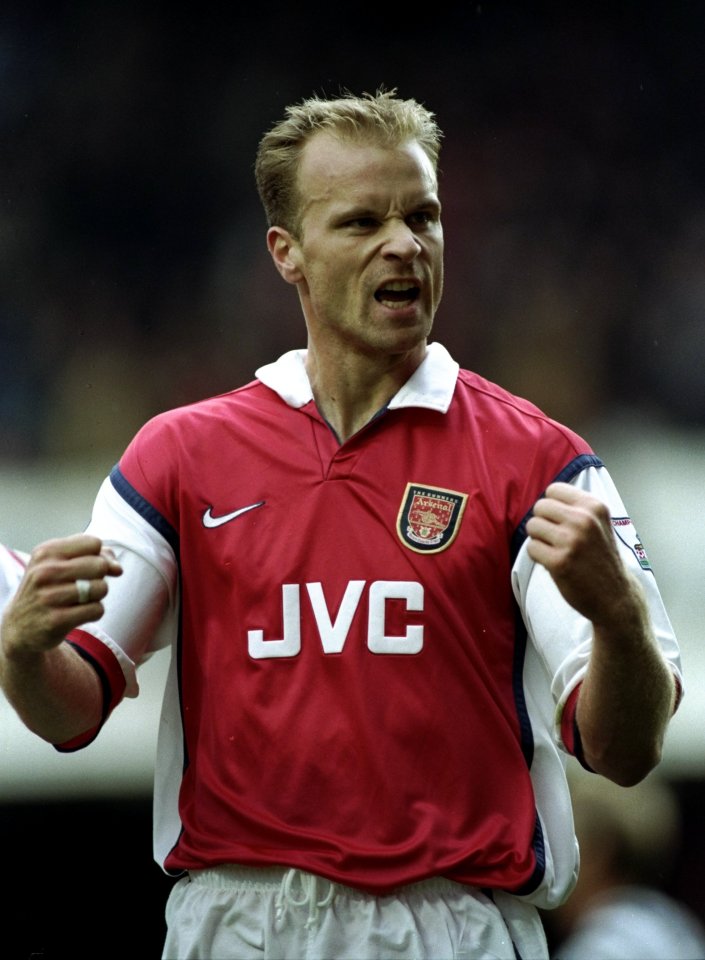 Dennis Bergkamp of Arsenal celebrating a goal.