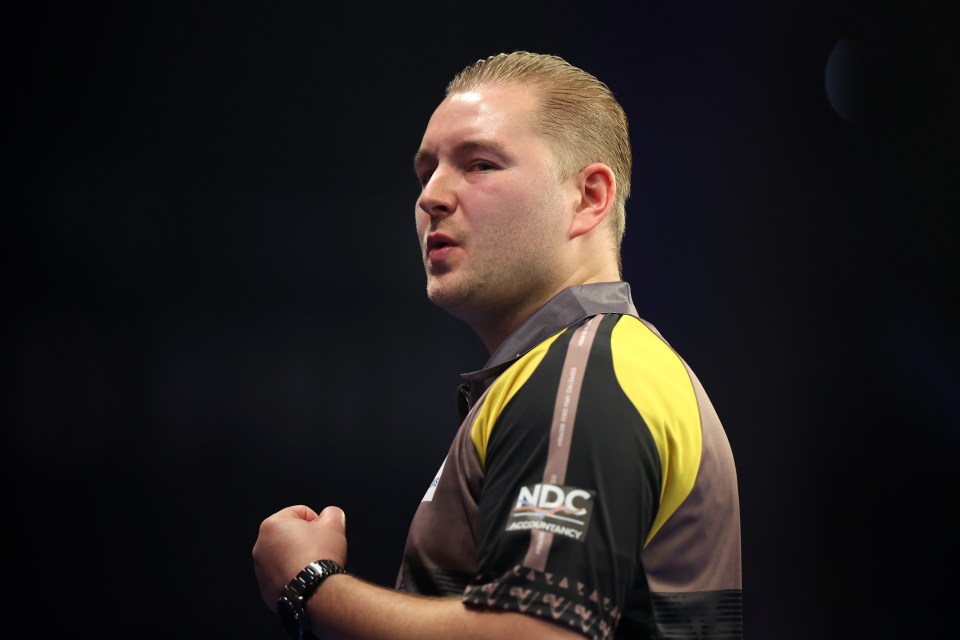 Dimitri Van den Bergh of Belgium at a darts match.