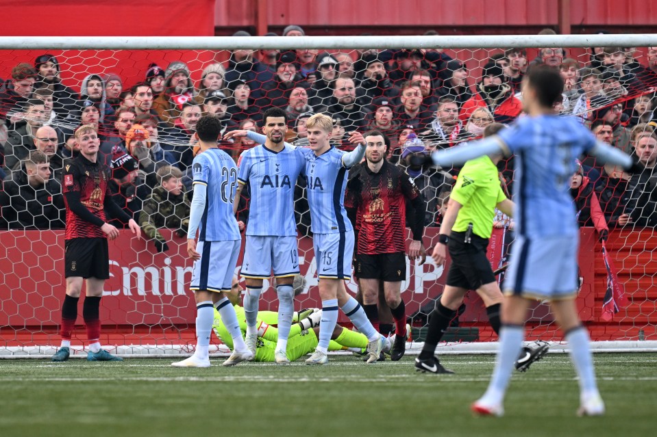 Tottenham Hotspur players celebrating a goal.