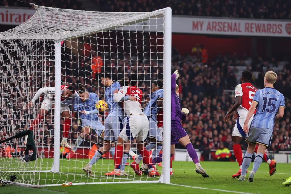 Dominic Solanke of Tottenham Hotspur scores an own goal during a soccer match.