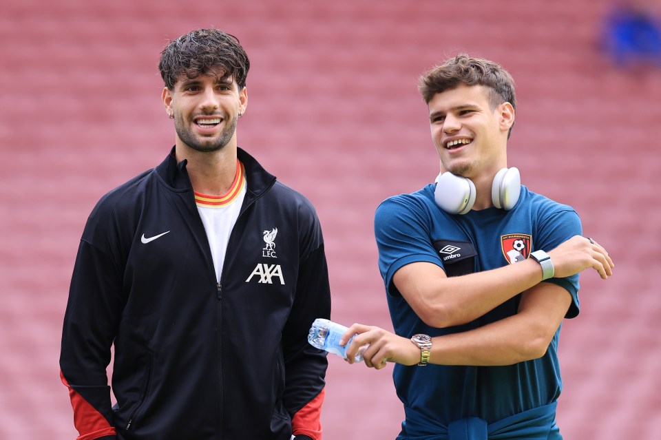 Dominik Szoboszlai of Liverpool and Milos Kerkez of Bournemouth talking before a Premier League match.