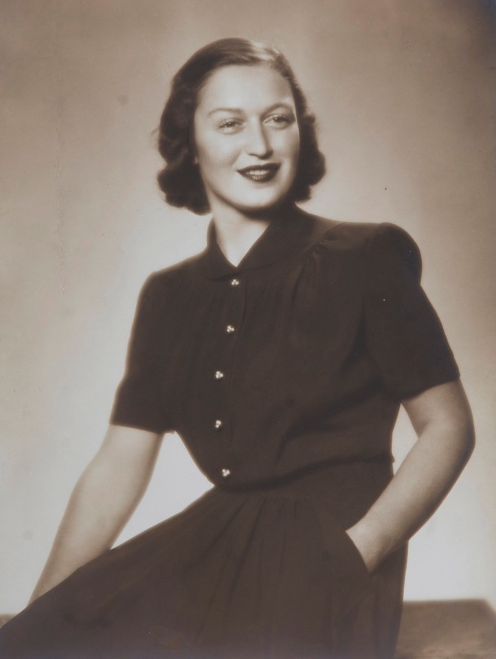 Black and white photo of Eva Clarke, a Holocaust survivor, in her Cambridge home.