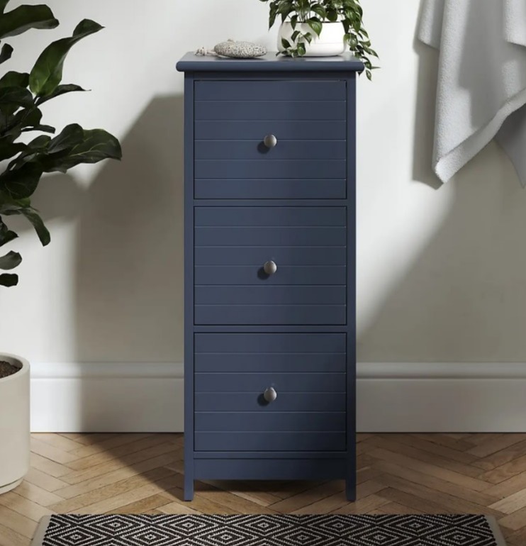 Tall navy blue three-drawer cabinet.