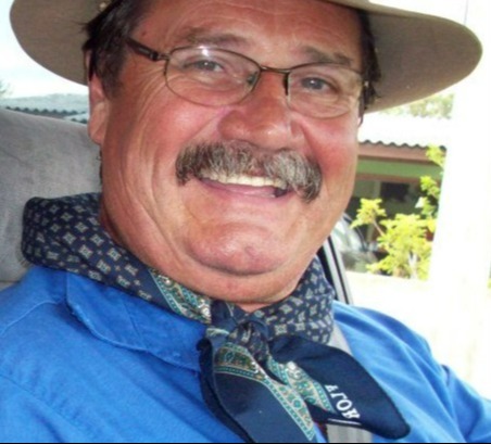 Paulo Luiz Dos Anjos, smiling man wearing a blue shirt and hat.