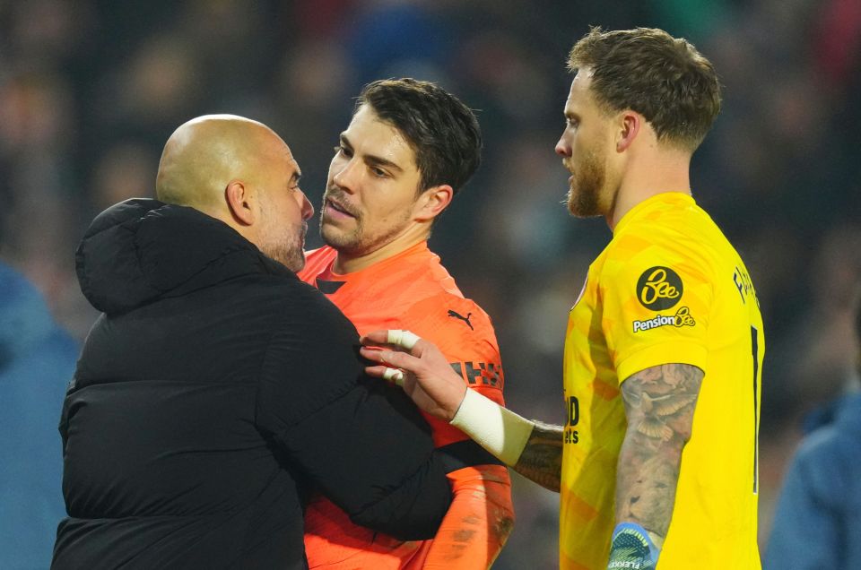 Pep Guardiola and Stefan Ortega in an intense confrontation.